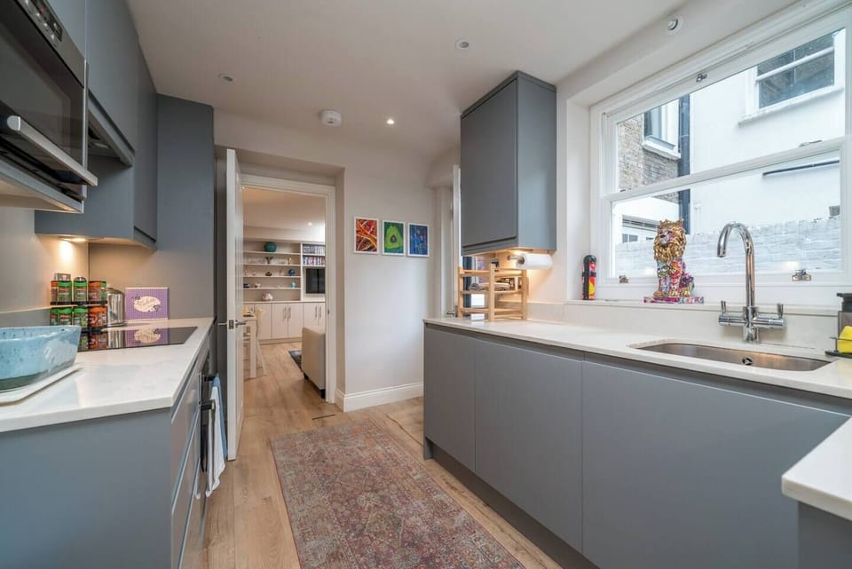 The sleek gray color scheme creates a modern and stylish atmosphere, while the glass window allows natural light to flood the space, making your cooking experience even more delightful. 