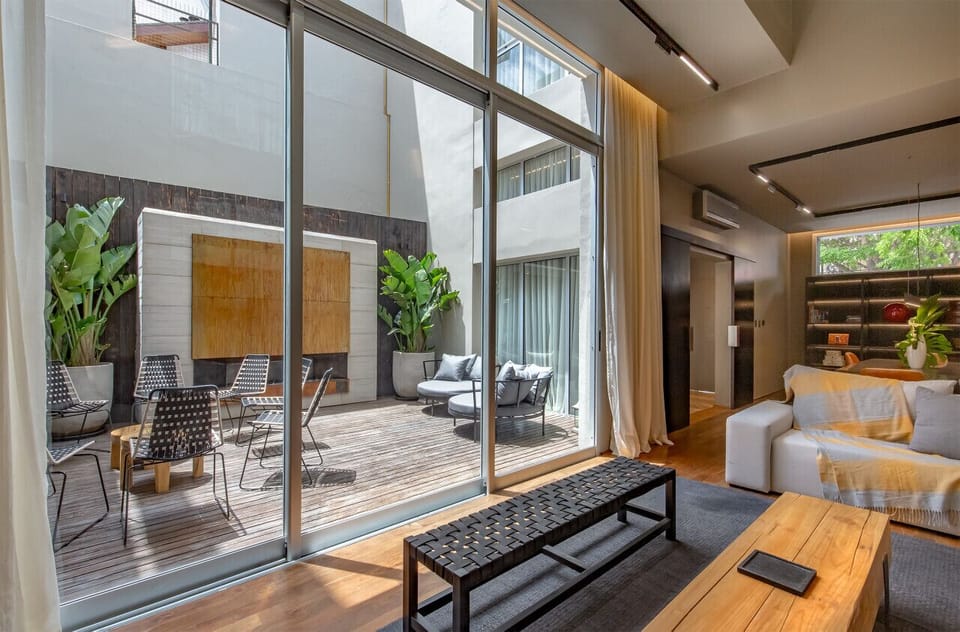 Private courtyard with fireplace your to enjoy.  The window/door opens to create an amazing indoor / outdoor space.