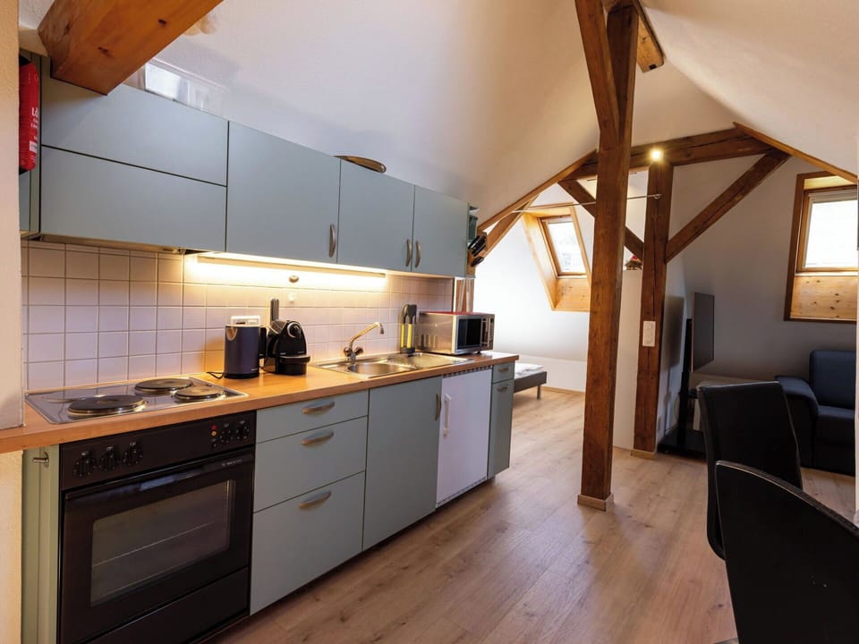 Kitchen, Countertop, Flooring, Wood, Interior Design, Furniture, Kitchen Appliance, Floor, Major Appliance, Cabinetry