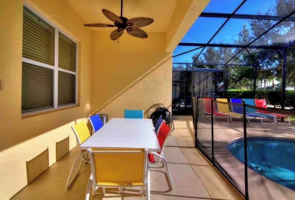 2 outdoor tables on the pool deck