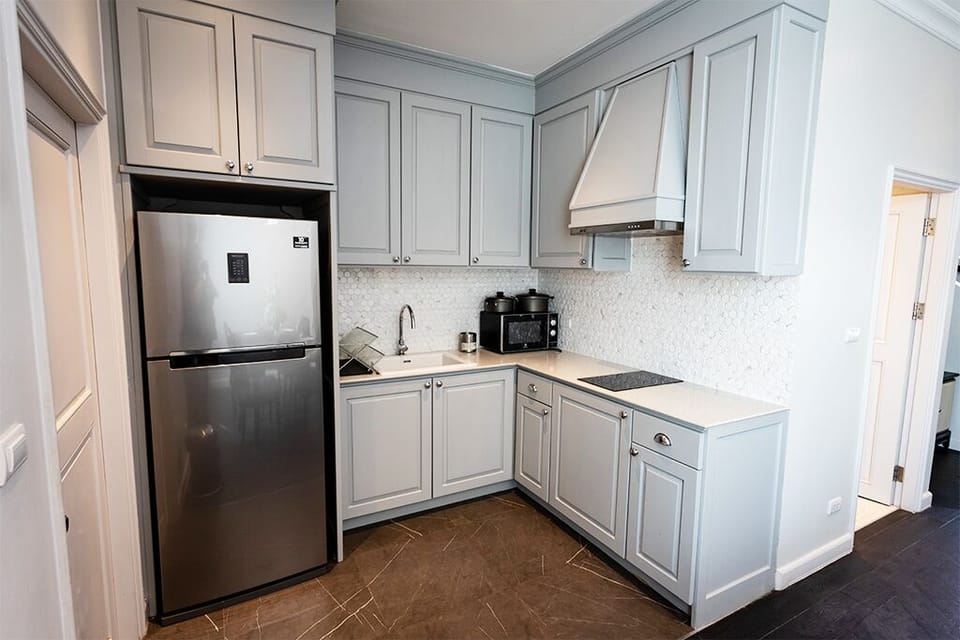 Kitchenette with mircowave, pots and utensils