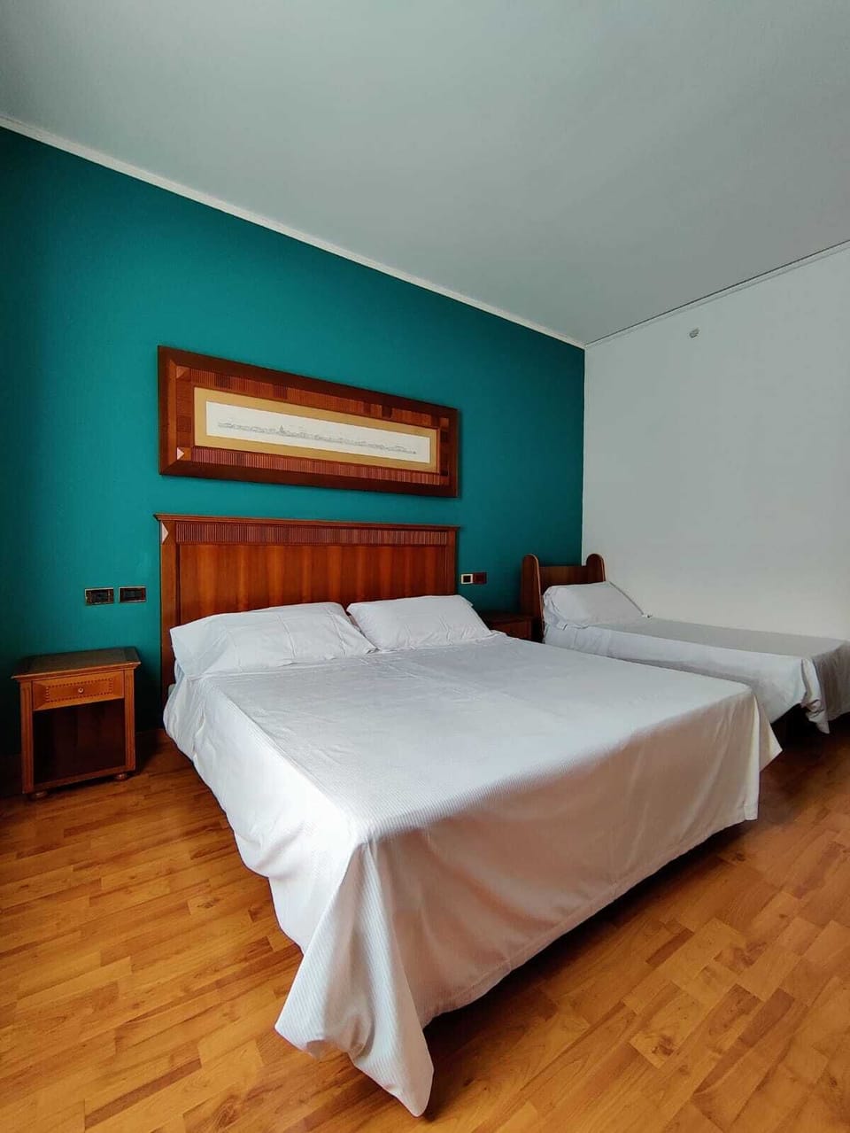Traditional Quadruple Room | Down comforters, minibar, in-room safe, desk