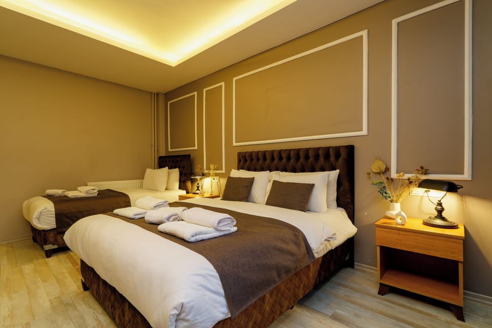 Deluxe Triple Room | In-room safe, laptop workspace, blackout drapes, soundproofing