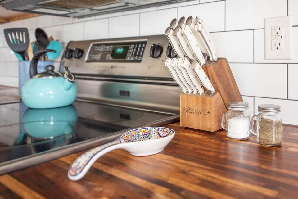 Butcher block countertops and a fully stocked, ready-to-use kitchen