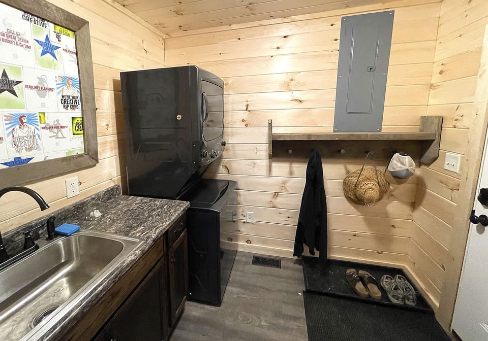 The mudroom access is where you kick off your shoes and clean your laundry.