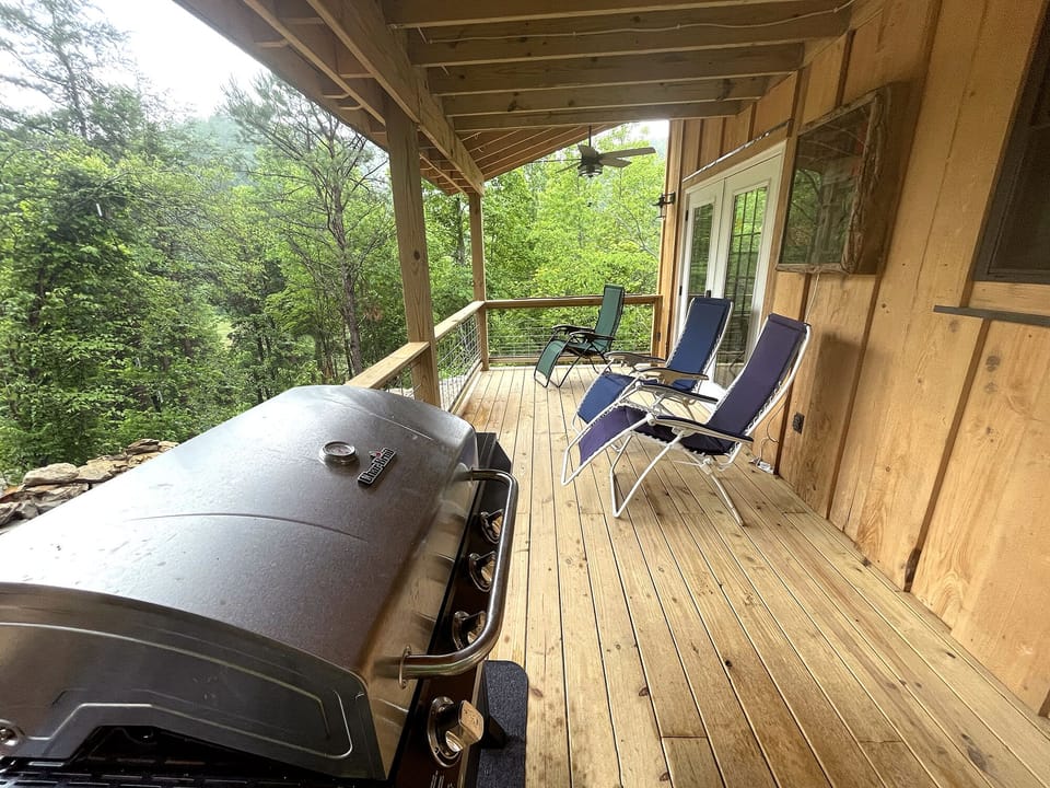 The covered deck comes equipped with a gas grill.