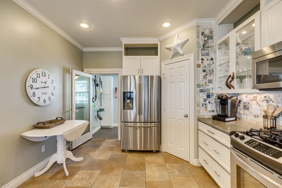 Through the kitchen, you'll find a full size laundry room