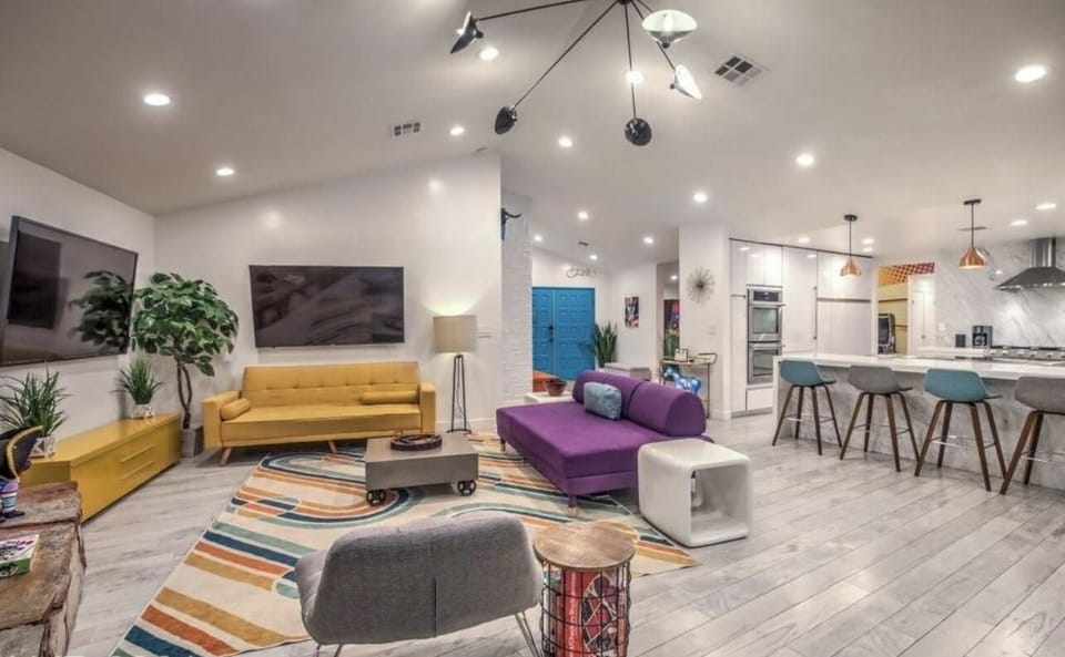 Spacious family room with double screen tv, sofa couch and games 