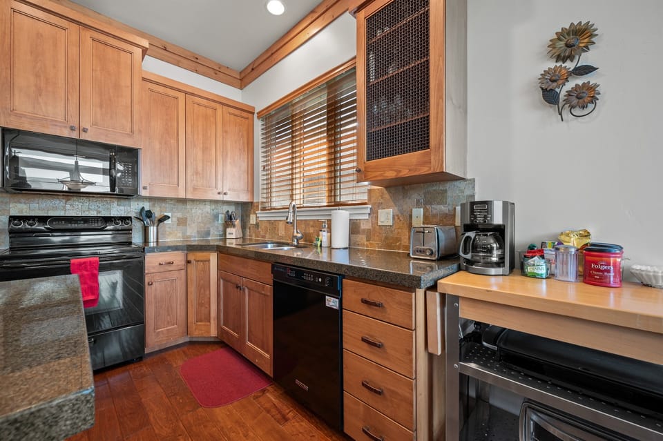 Cook your favorite meals in a kitchen bathed in natural light that enhance the culinary experience.