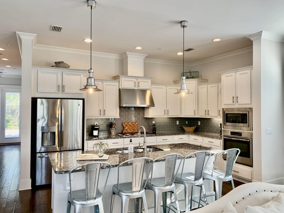 Large kitchen with tons of cooking space and island seating 