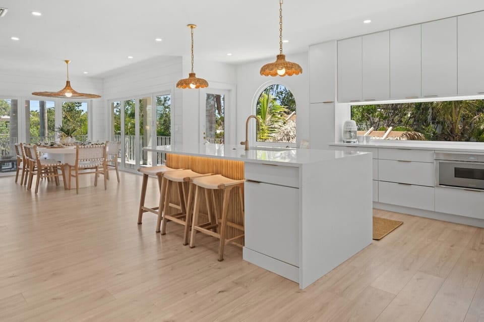 Kitchen and dining room surrounded by tropical views