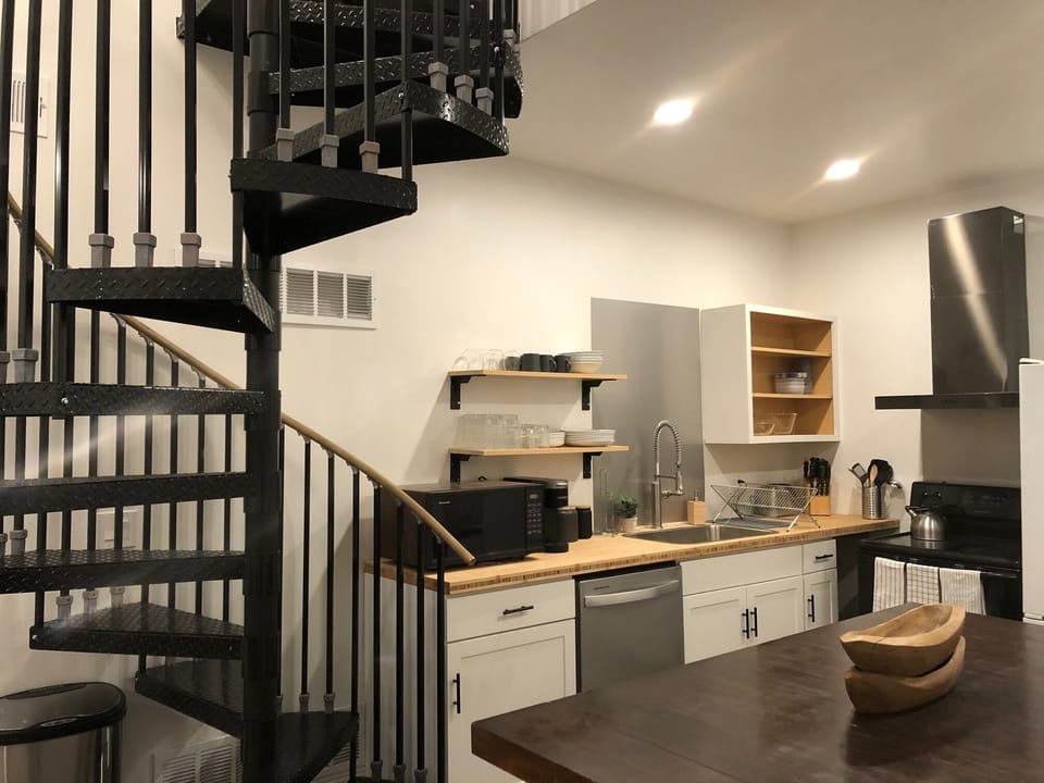 Modern Kitchen w/ Dishwasher, microwave, garbage disposal & Vented range hood.