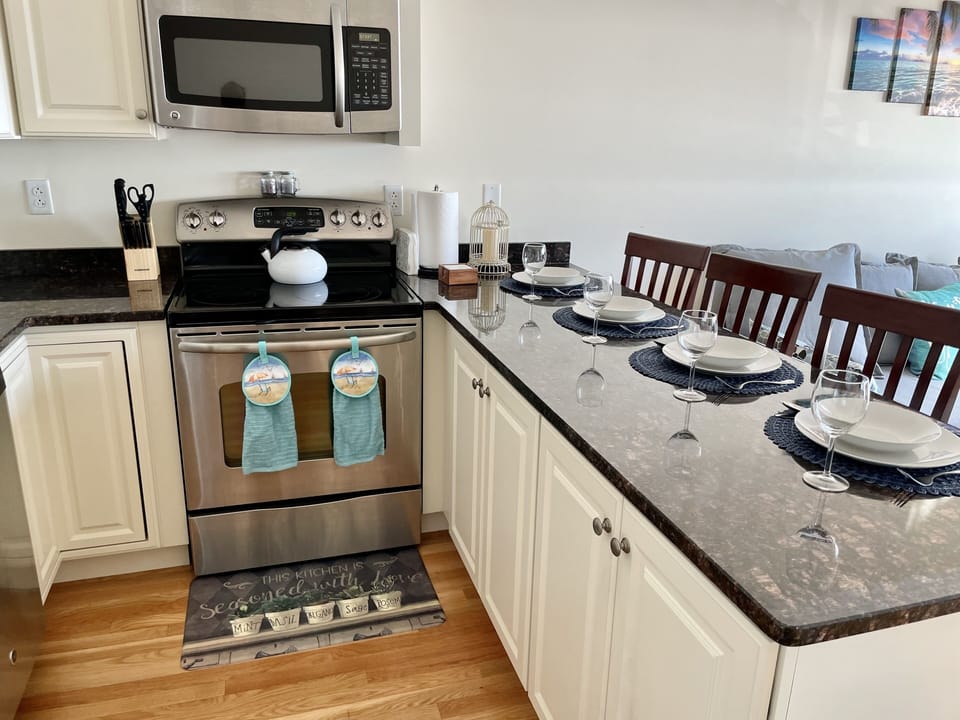 Fully furnished kitchen with dinnerware and silverware
