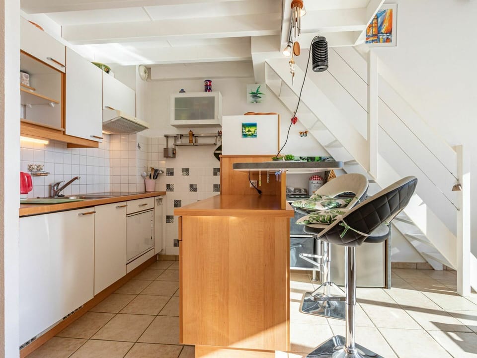 Cabinetry, Furniture, Building, Countertop, Kitchen, Wood, Interior Design, Kitchen Stove, Drawer, Chair