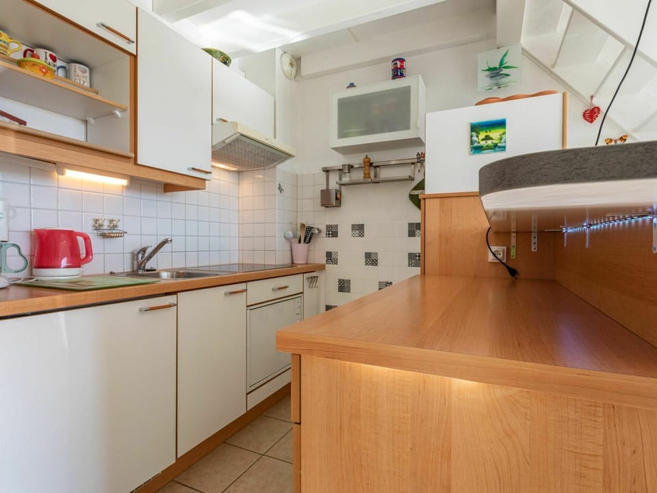 Cabinetry, Building, Property, Countertop, Kitchen, Kitchen Appliance, Home Appliance, Kitchen Stove, Lighting, Wood