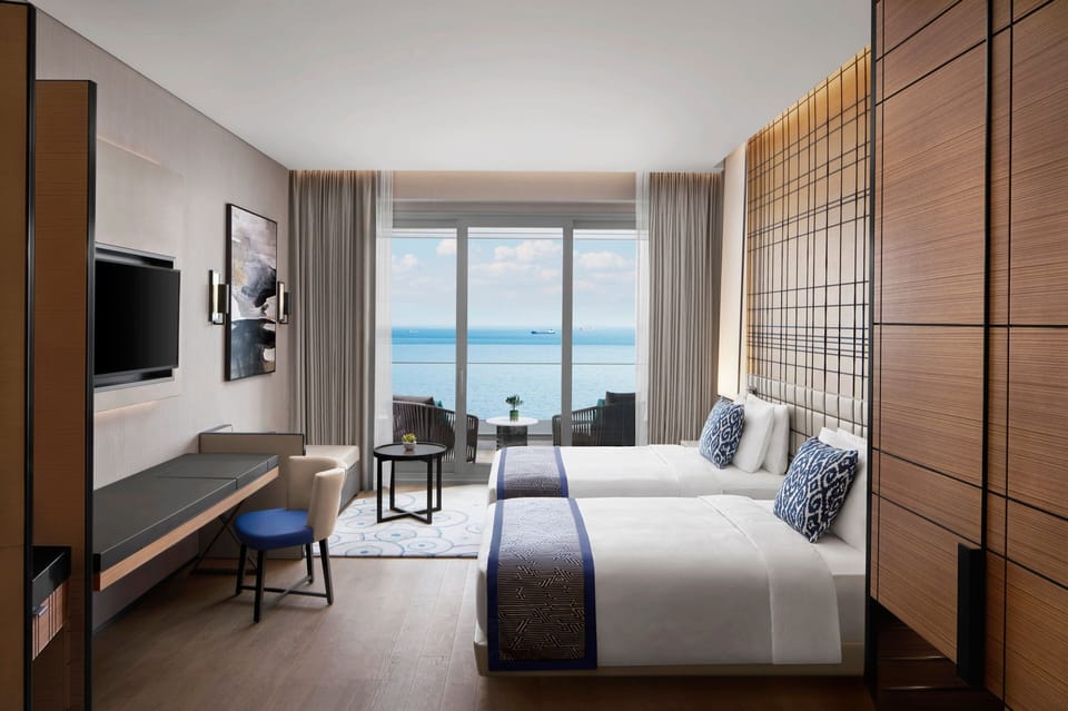 Deluxe Sea View, Guest room, 2 Twin, Sea view, Balcony | Premium bedding, down comforters, pillowtop beds, minibar