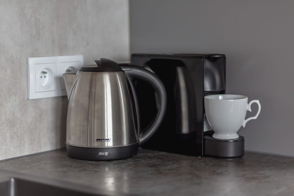 The fully equipped kitchenette includes everything you need for a home-cooked meal.