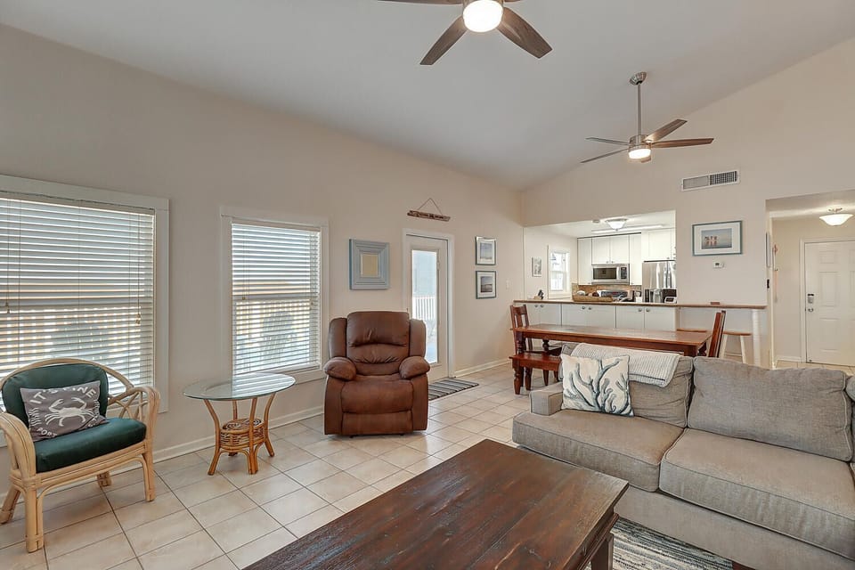 Relax in your bright, open living space with comfortable seating and modern fans keeping you cool.