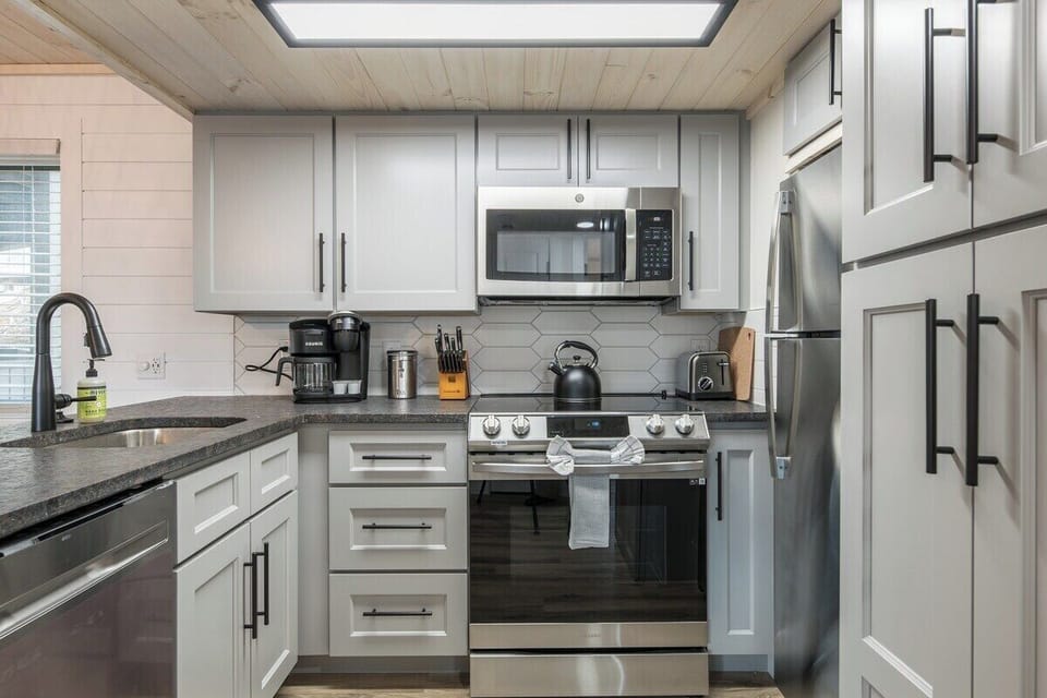 Full Kitchen View w/ Stainless Steel Appliances & Countertop Gadgets