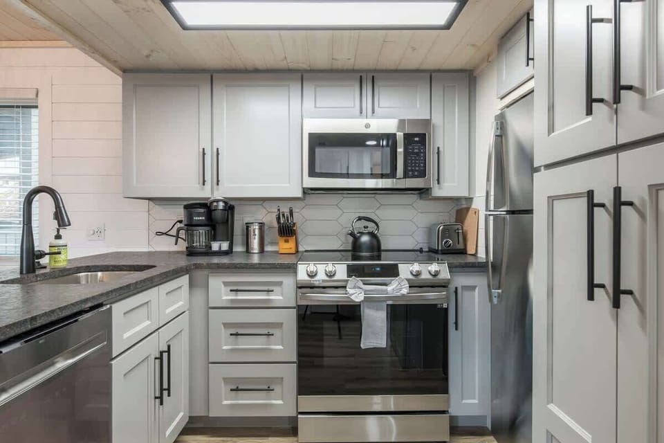 Full Kitchen View w/ Stainless Steel Appliances & Countertop Gadgets