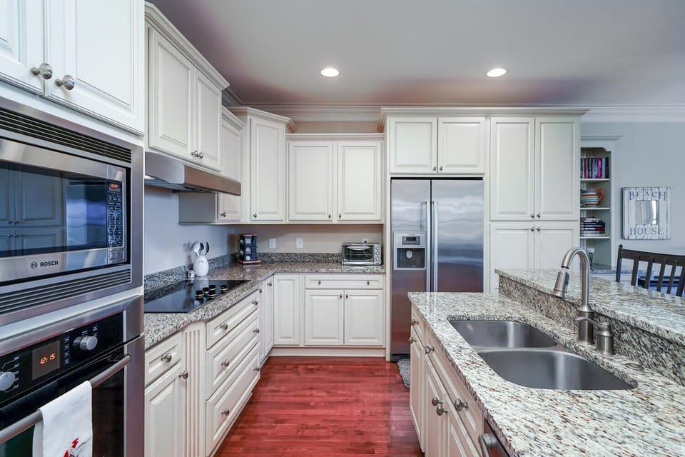 Side by side French door refrigerator with automatic ice maker.