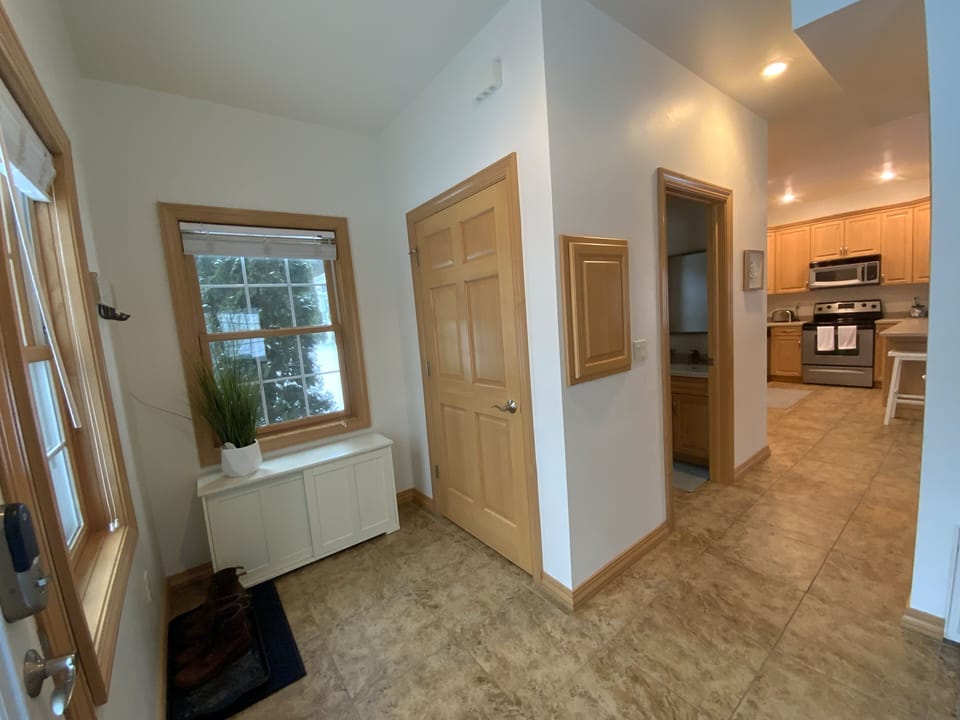 Living room transitions to kitchen, with half-bath on main floor