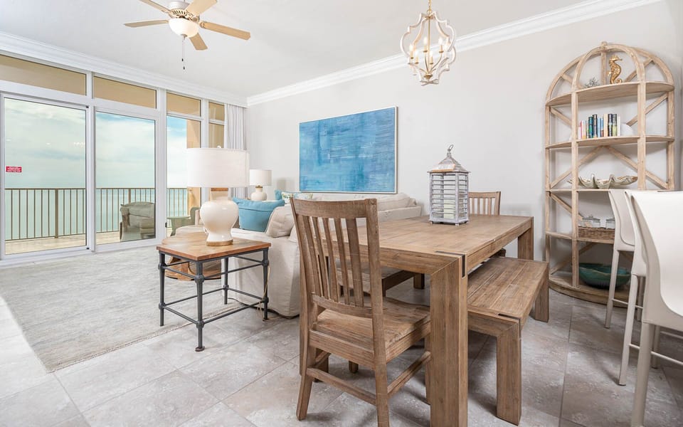 Gather around the rustic dining table to share laughter and connect while enjoying coastal views just beyond