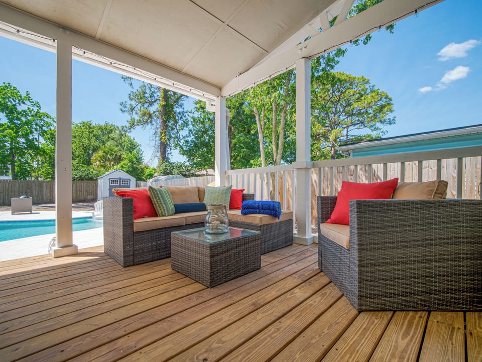 Shaded outdoor lounge overlooking the private pool.