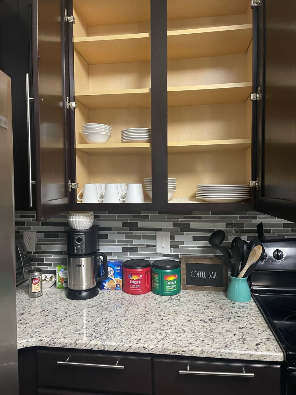 Coffee maker, Regular and decaf coffee, creamer and sugar provided.