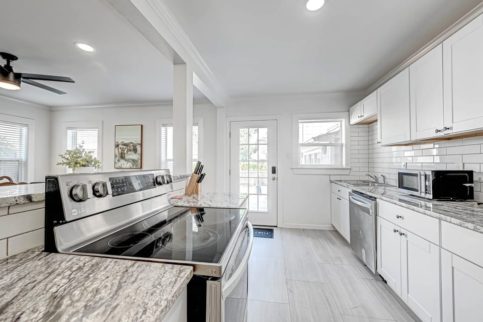 Large kitchen. New stainless appliances Spring 2022. Back entrance shown here.