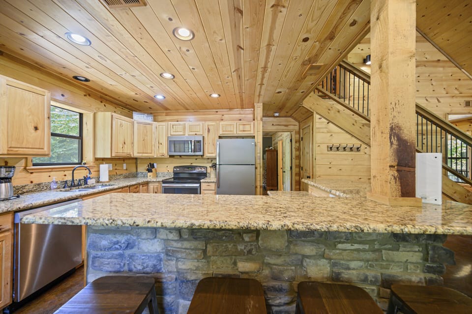 Fully equipped kitchen with bar seating — perfect for cooking together.