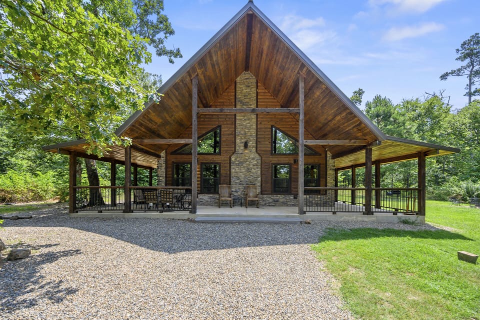 Welcoming front view — your peaceful cabin tucked into the trees.