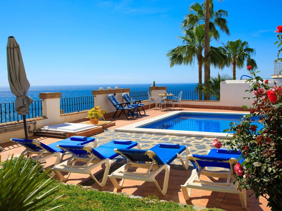 Water, Sky, Plant, Flower, Swimming Pool, Azure, Seaside Resort, Building, Outdoor Furniture, Tree