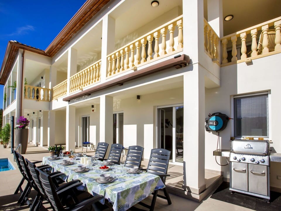 Sky, Furniture, Property, Table, Building, Chair, Shade, Interior Design, Outdoor Furniture, Window