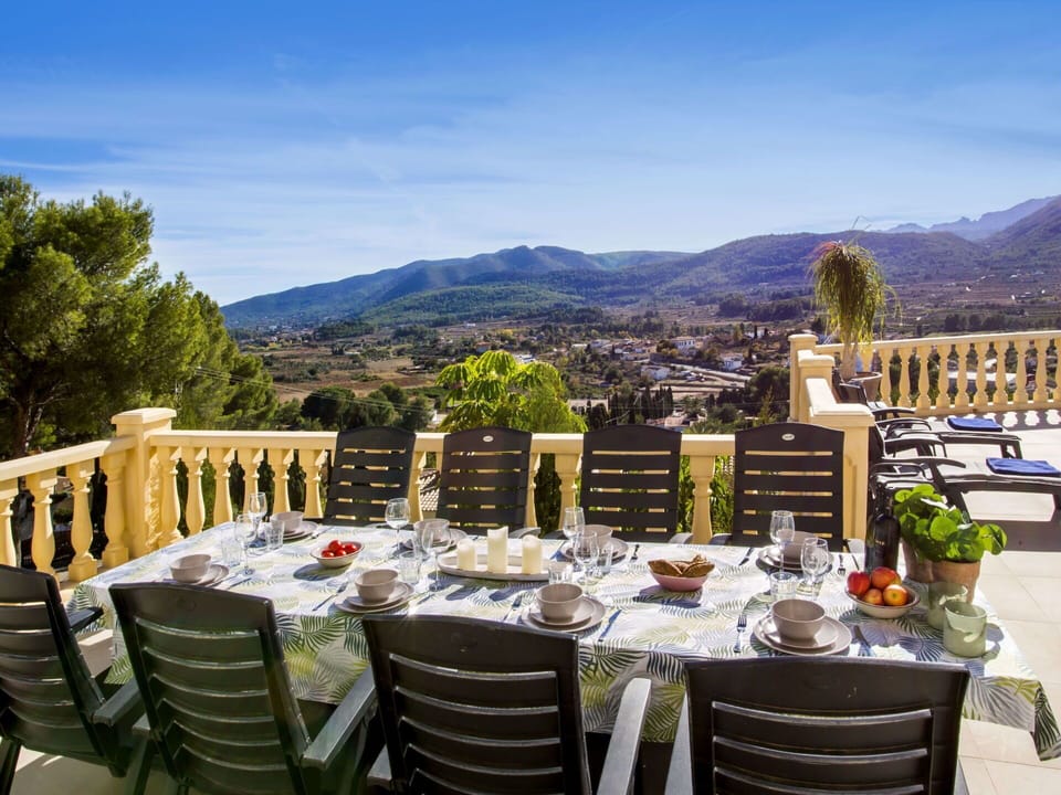 Table, Sky, Furniture, Property, Chair, Outdoor Table, Tablecloth, Mountain, Outdoor Furniture, Building