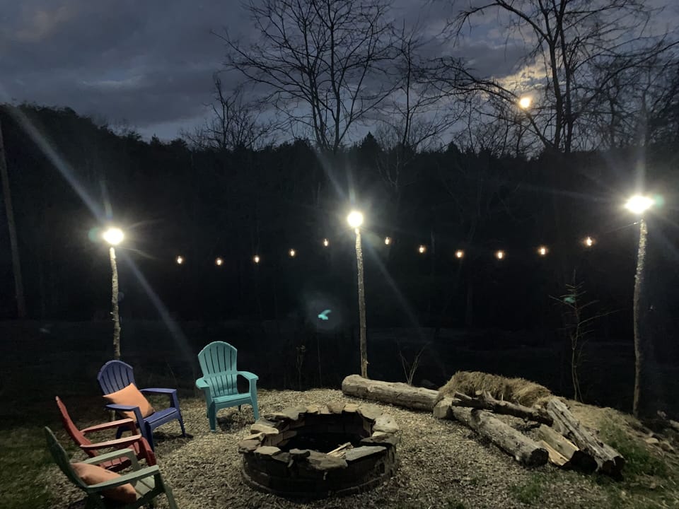 Firepit with Moon in background at Wandering Goat Lodge