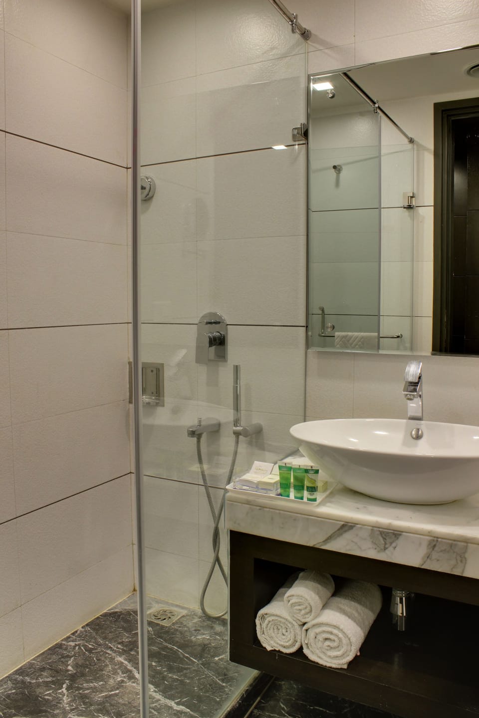 Shower, rainfall showerhead, designer toiletries, hair dryer
