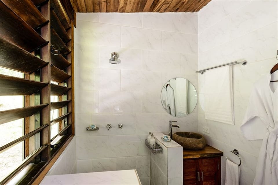 Shower, designer toiletries, hair dryer, bathrobes