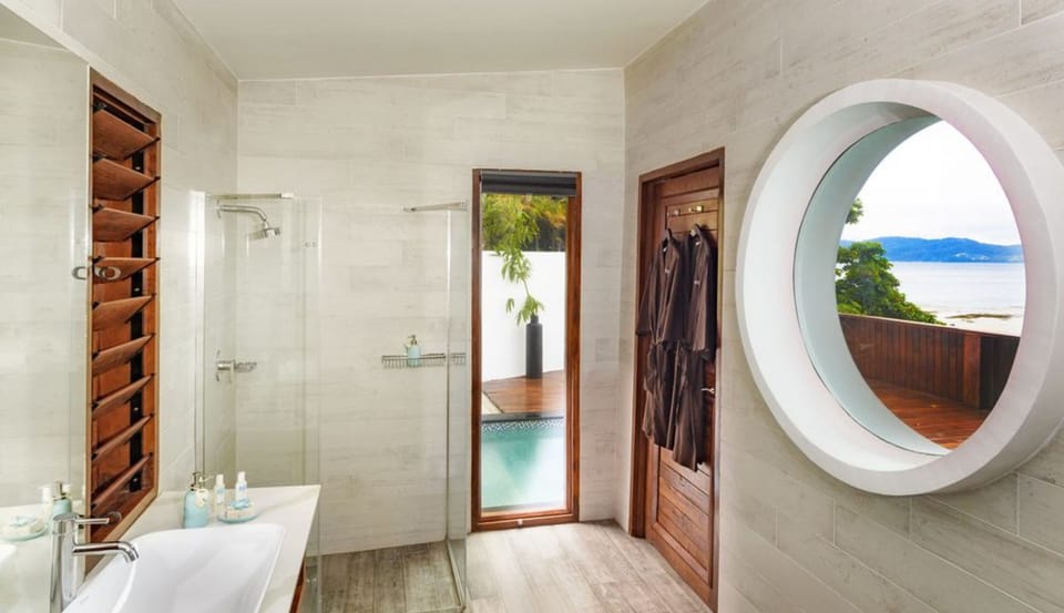Shower, designer toiletries, hair dryer, bathrobes