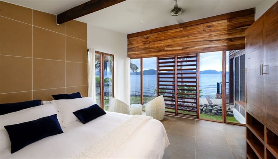 Two Bedroom Oceanfront Retreat | Premium bedding, minibar, in-room safe, blackout drapes