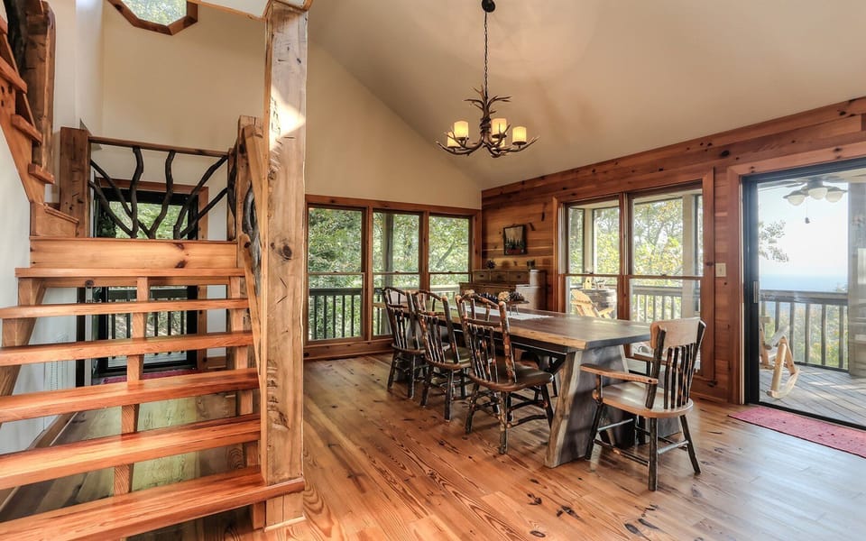 Elegant dining area with rustic charm, open views, and natural wood elements.