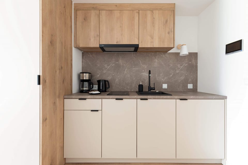 The fully equipped kitchenette includes everything you need for a home-cooked meal.