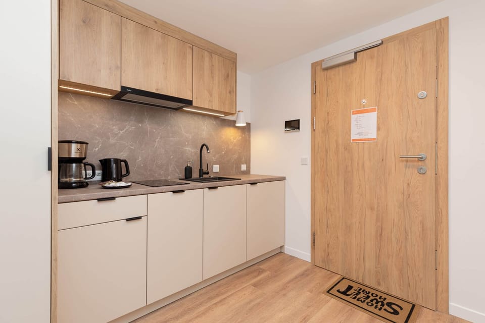 Cook and dine in style with the modern kitchenette and dining area.