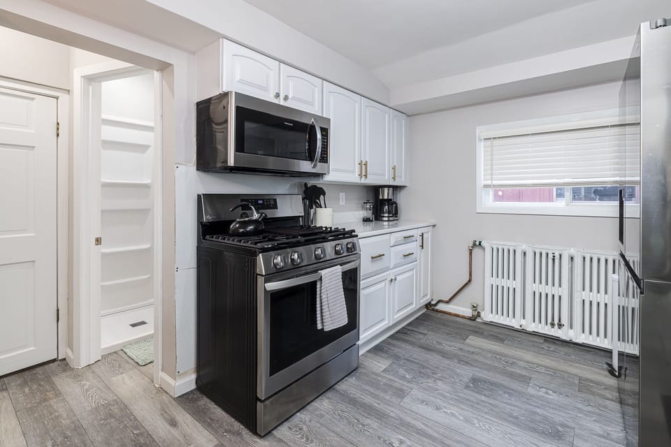 Off of kitchen is basement laundry area and bathroom 1.
