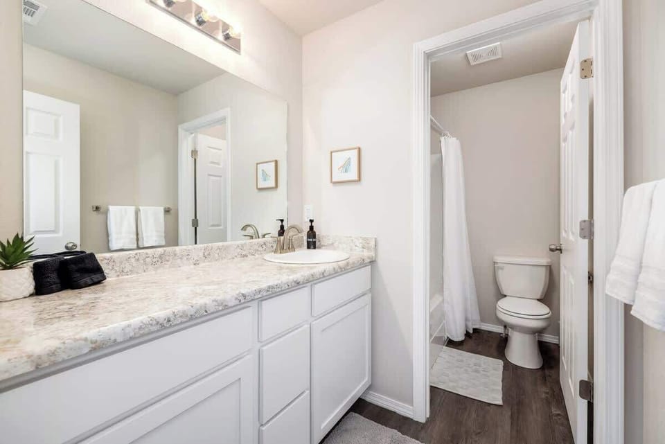 Our Master bath has a single sink, TONS of counter space and a shower + tub combo.