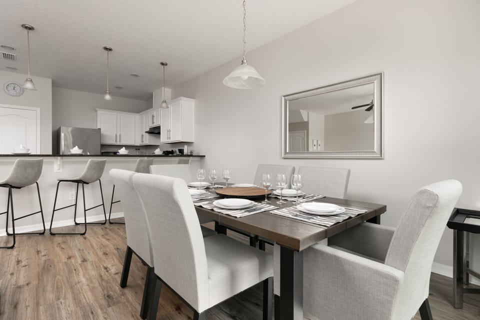 Living room flows into stylish dining & equipped kitchen.