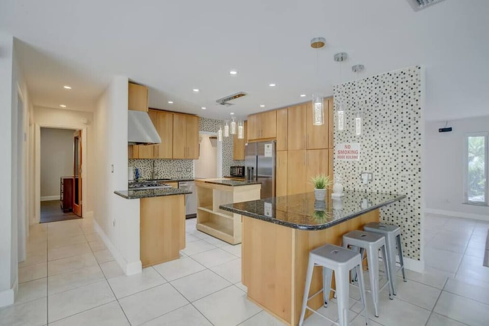 `Warm wood tones, soft light, and the promise of delicious meals - this kitchen is pure comfort food heaven.`