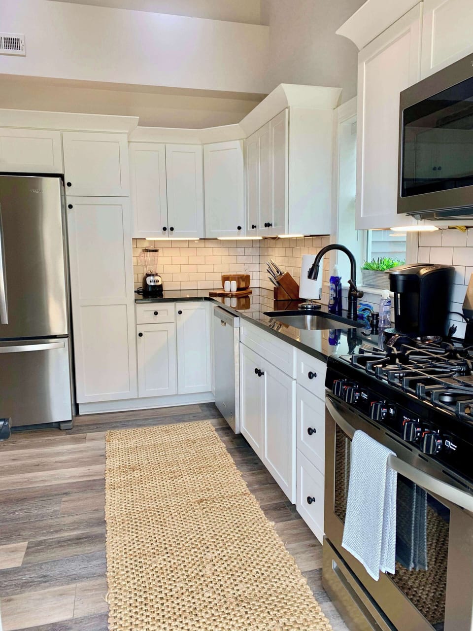 New Kitchen with stainless steel appliances and granite counter tops