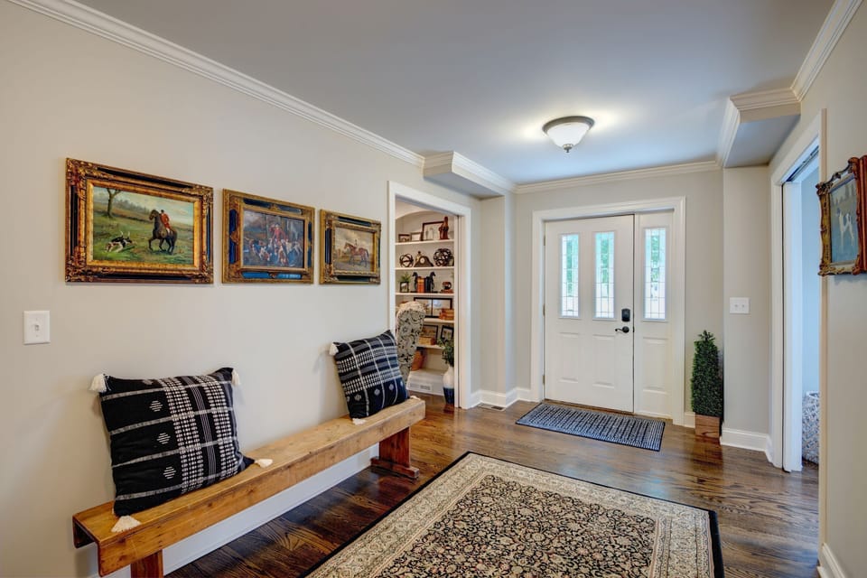 Hallway to front door and to upstairs