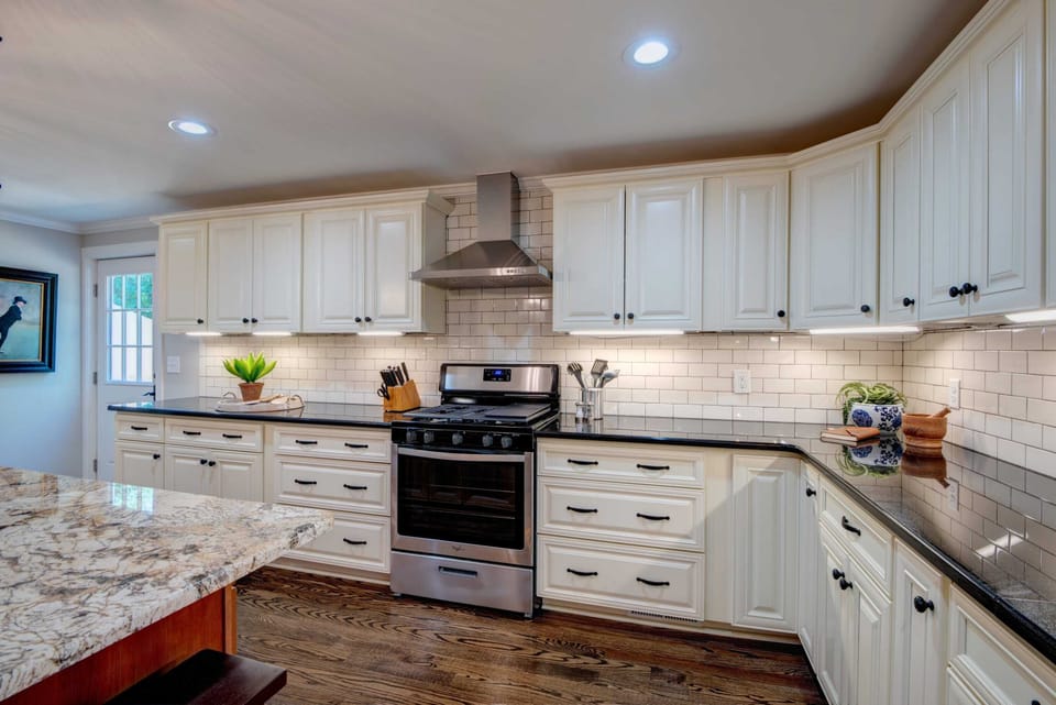 Chef's stove with lots of cupboards and counter space.